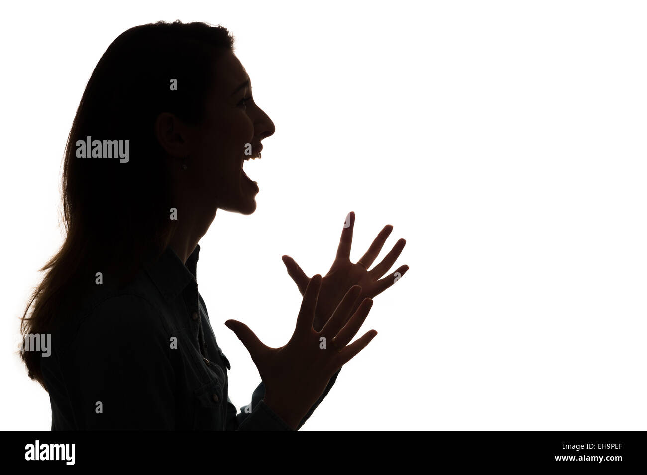 Profilo di donna urlare in silhouette Foto Stock