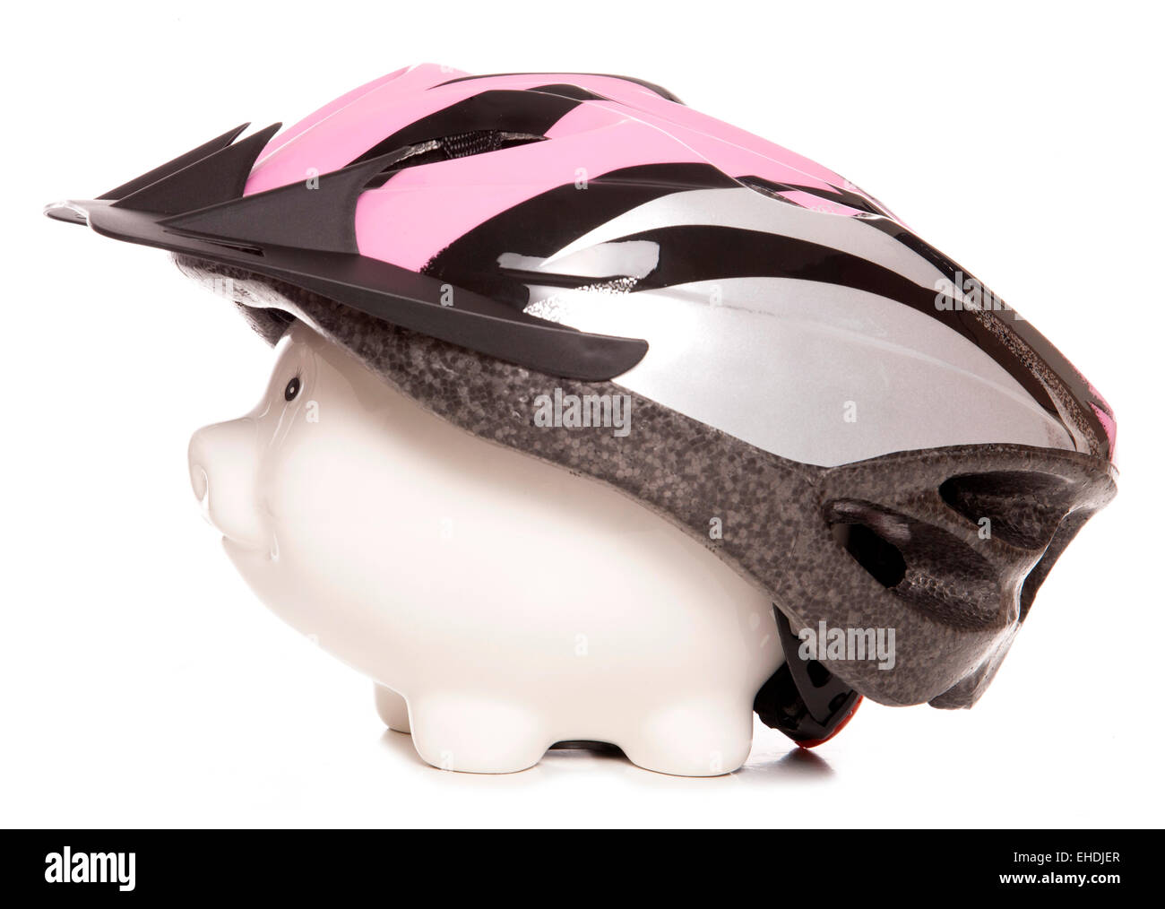 Salvadanaio indossando il ciclismo casco ritaglio Foto Stock