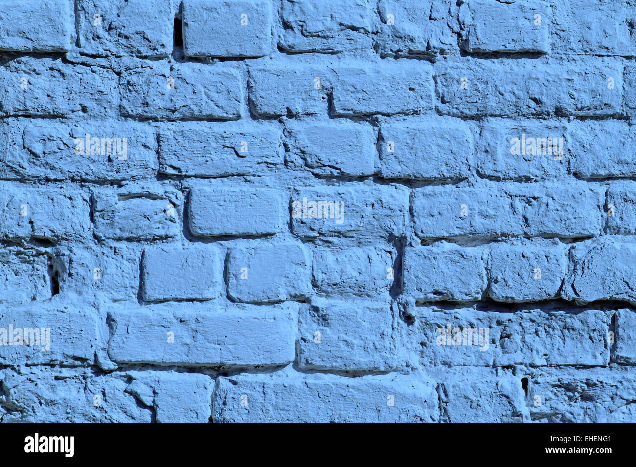 Il dipinto di blu un muro di mattoni Foto Stock