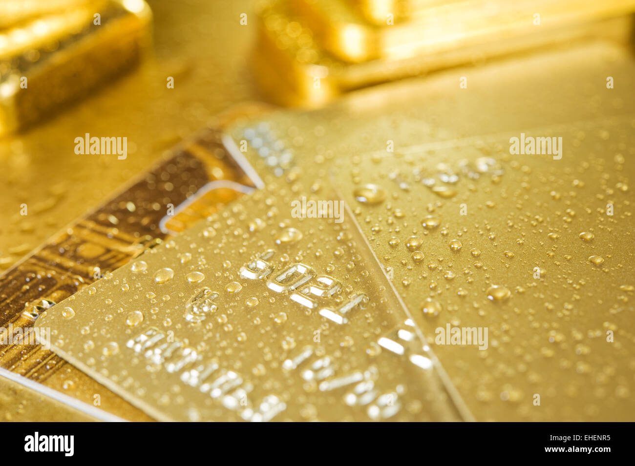 Oro e carta di credito Foto Stock