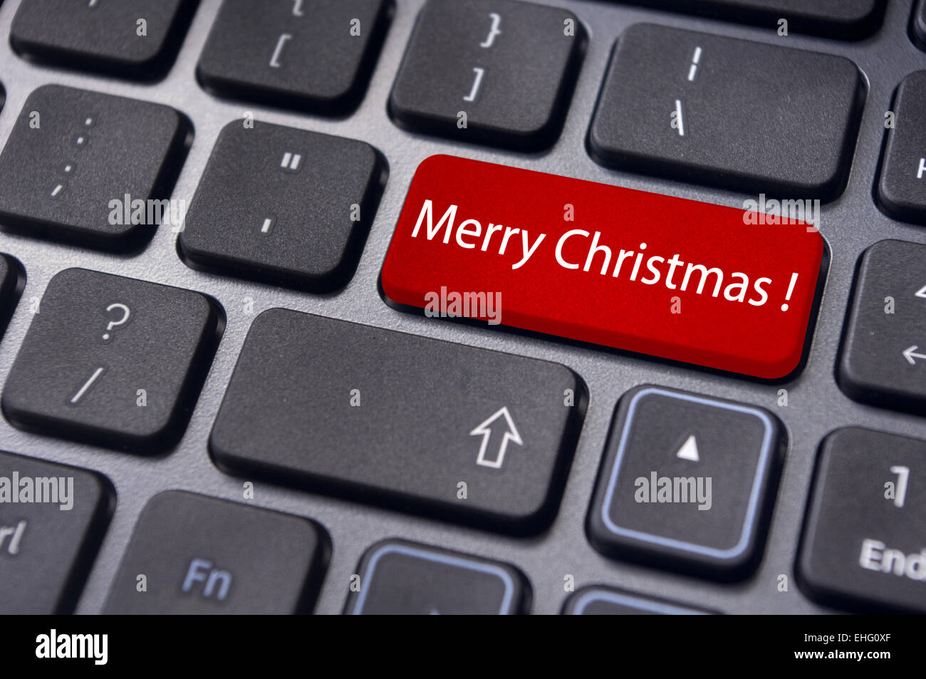 Buon Natale saluti sulla tastiera il tasto invio Foto stock - Alamy