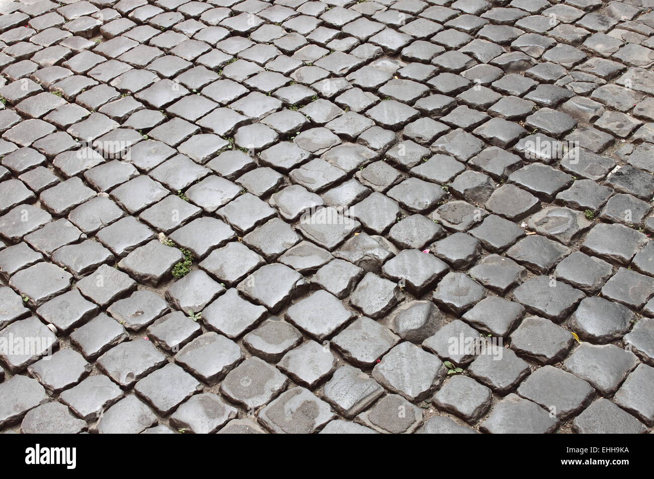 Molto vecchia romana pavimentazione di pietra Foto Stock