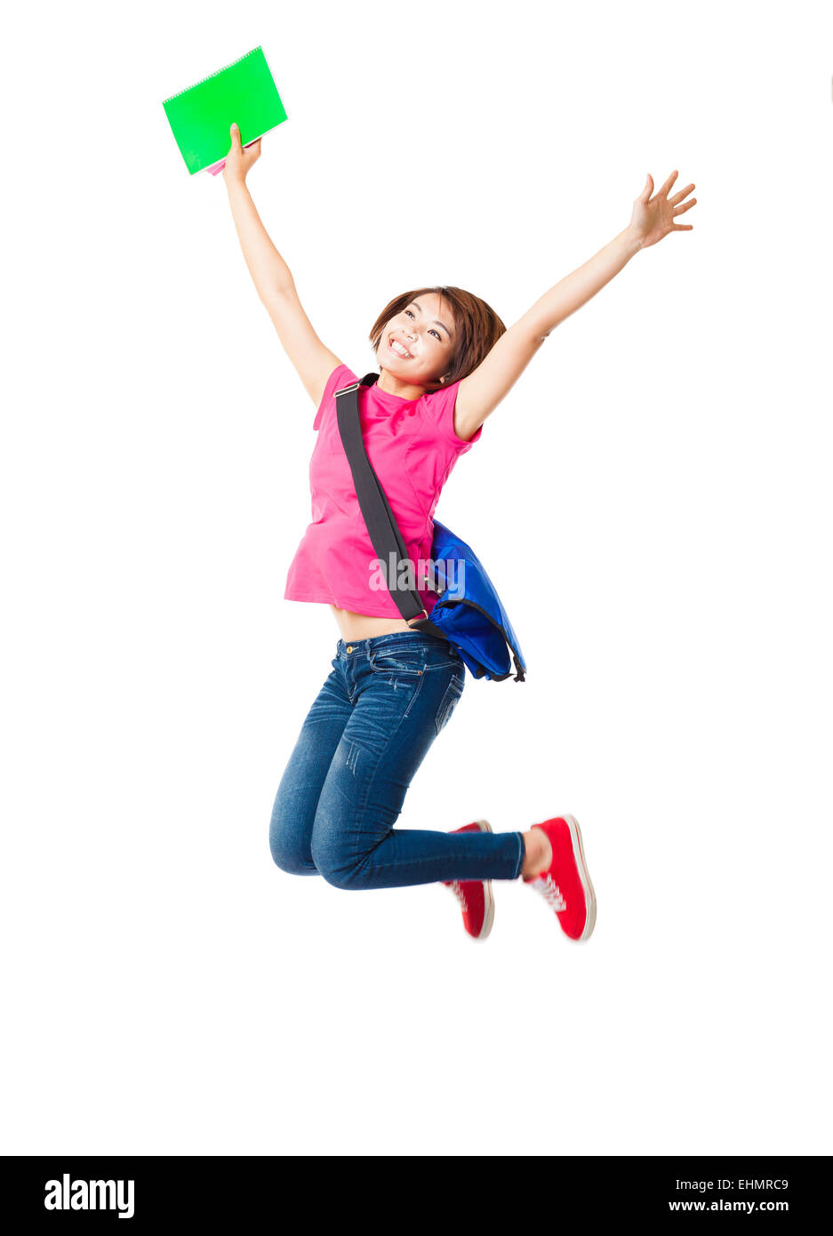 Giovane donna felice e studente jumping Foto Stock
