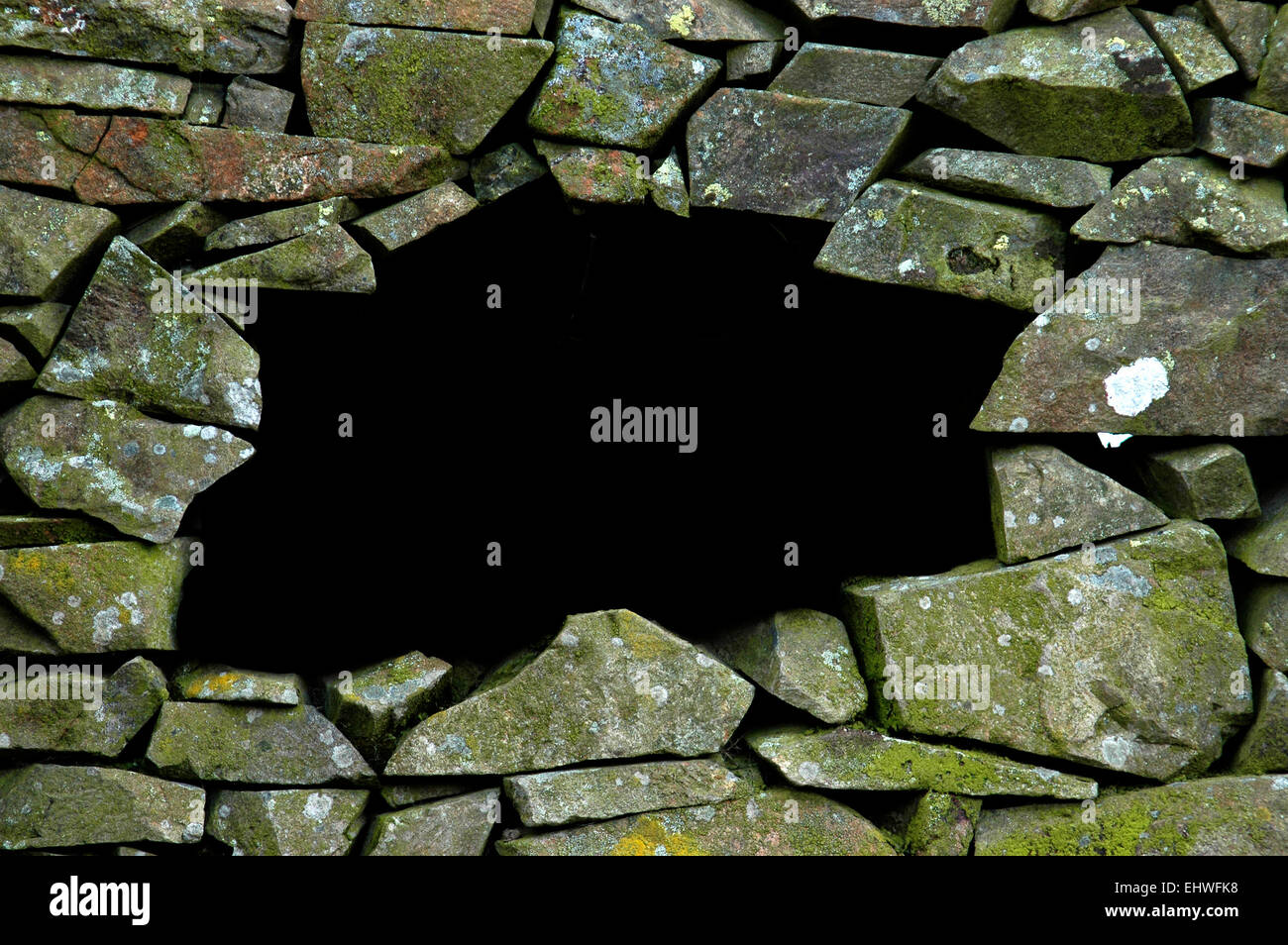 Un secco tradizionale muro di pietra con copia spazio per il testo Foto Stock