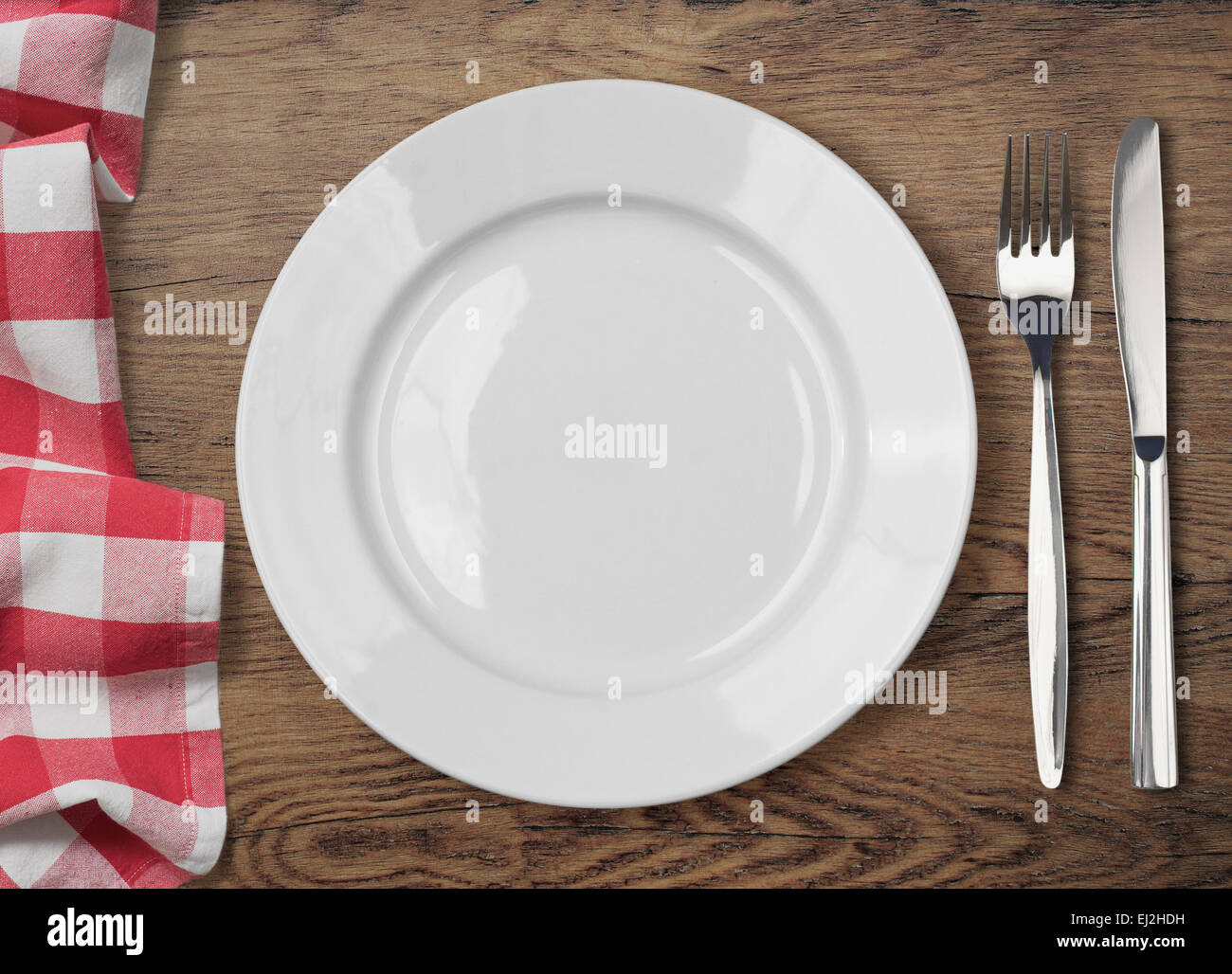 Tavolo da pranzo con piastra da pranzo, forchetta e coltello vista superiore Foto Stock