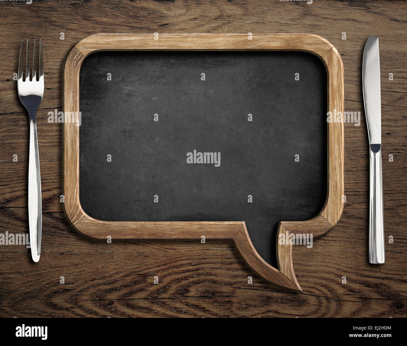 Lavagna con coltello e forchetta in legno tavolo da pranzo Foto Stock