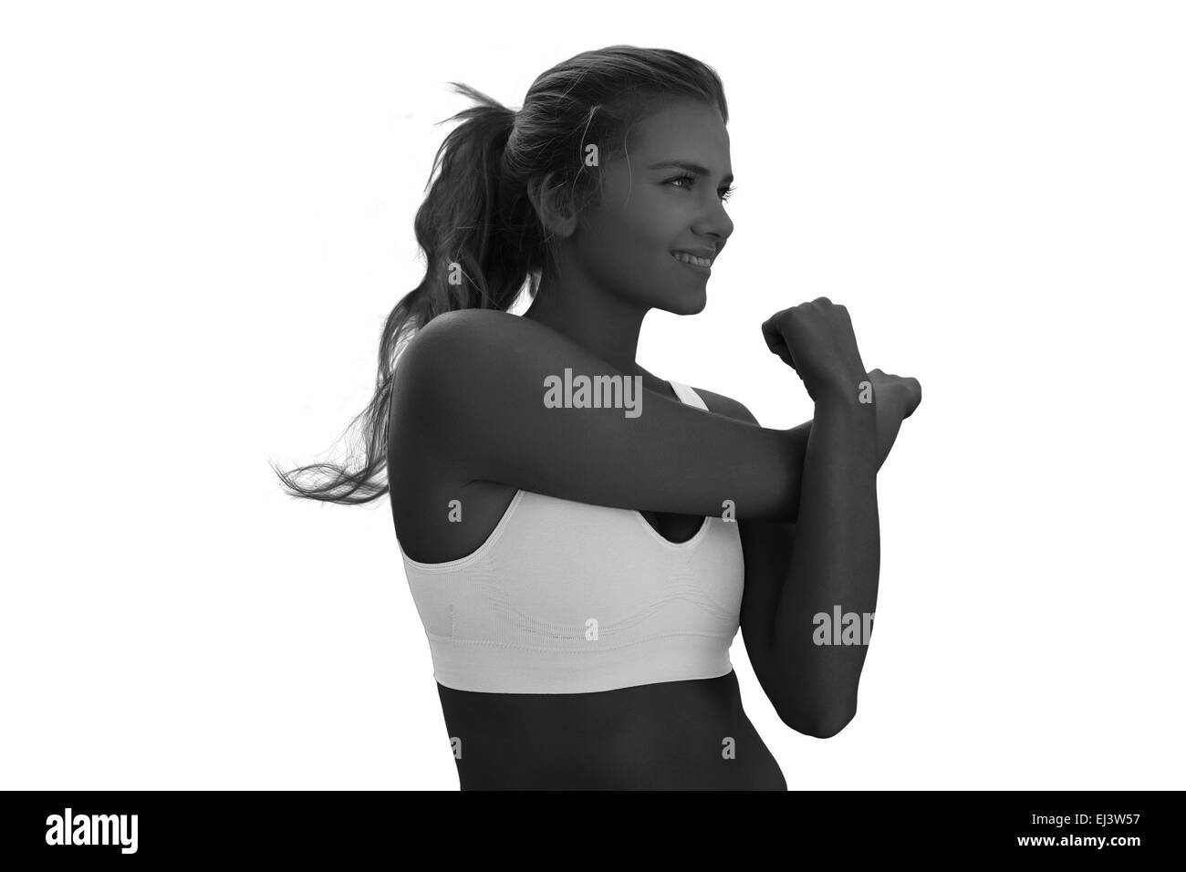 Immagine composita di sorridere tonica donna esercita sulla spiaggia Foto Stock