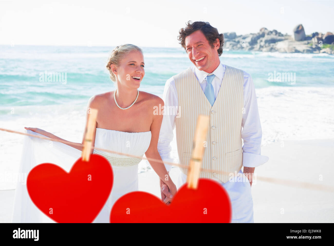 Immagine composita di sposi camminando mano nella mano e ridere Foto Stock