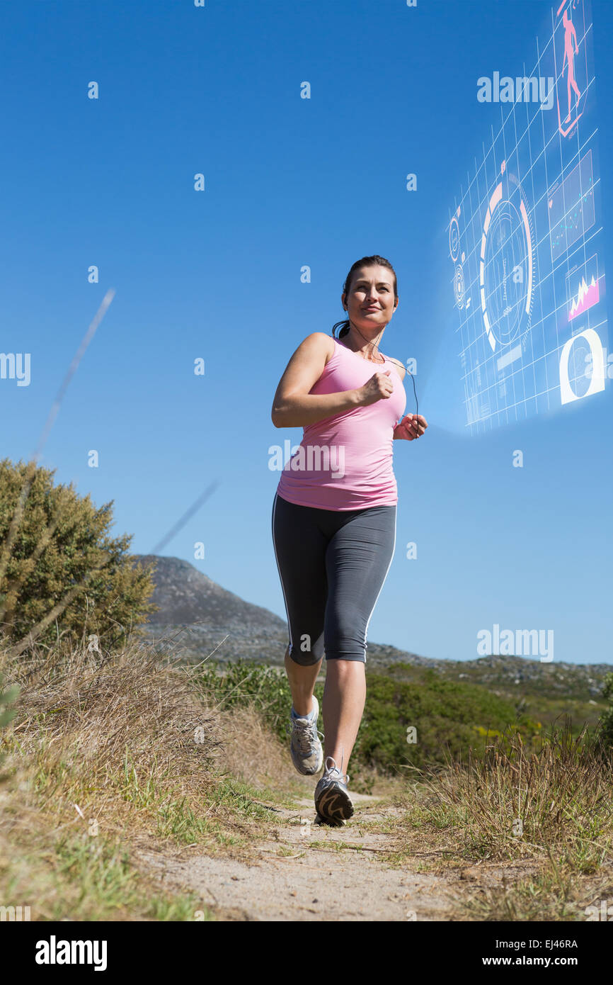 Immagine composita della donna attiva jogging in campagna Foto Stock