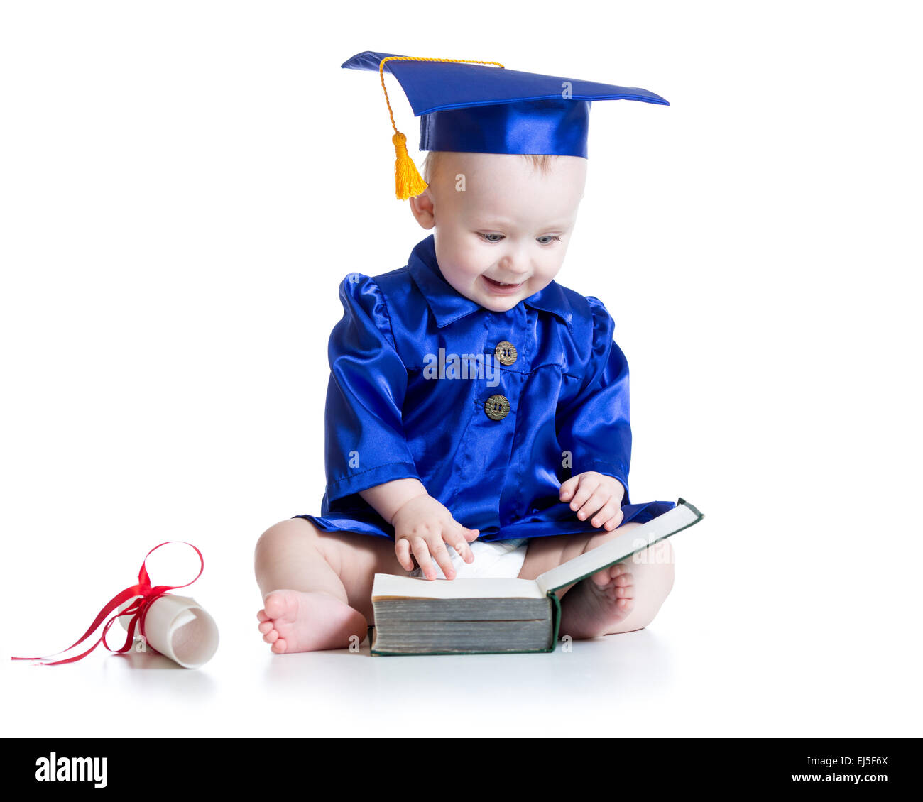 Funny baby in student hat con libro Foto Stock