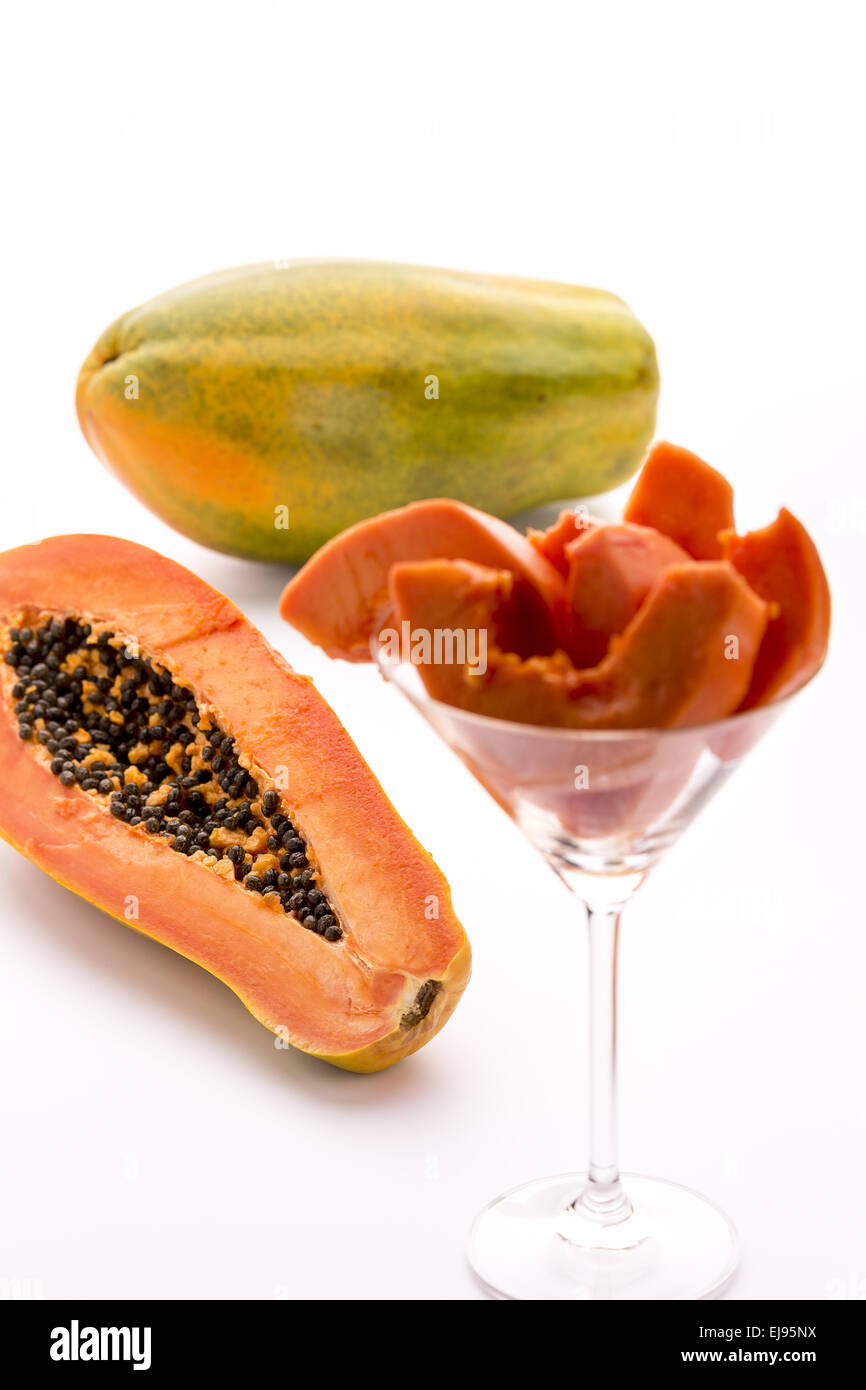 Papaya - un globose, verde e frutto giallo Foto Stock