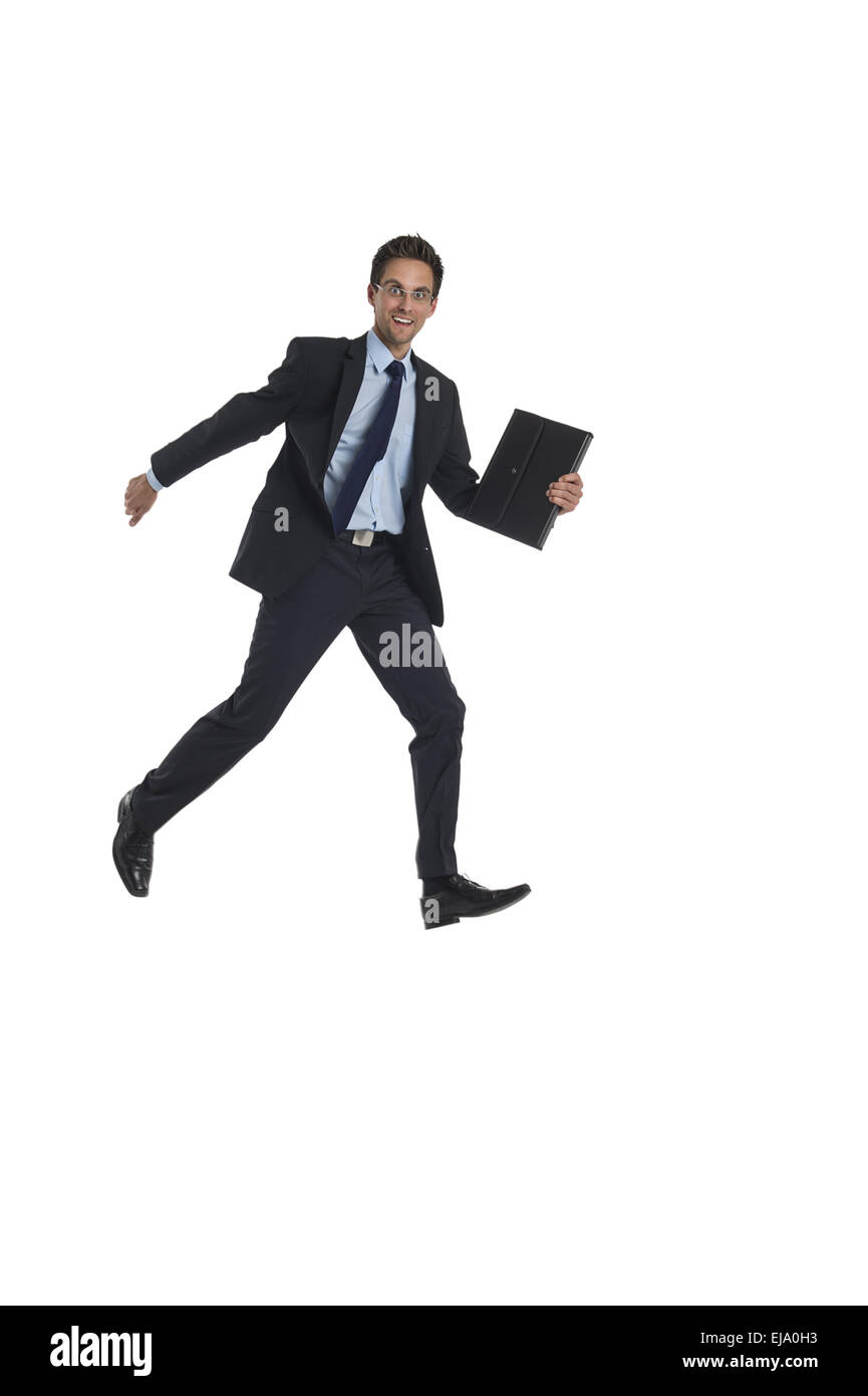 Jumping imprenditore con valigetta Foto Stock