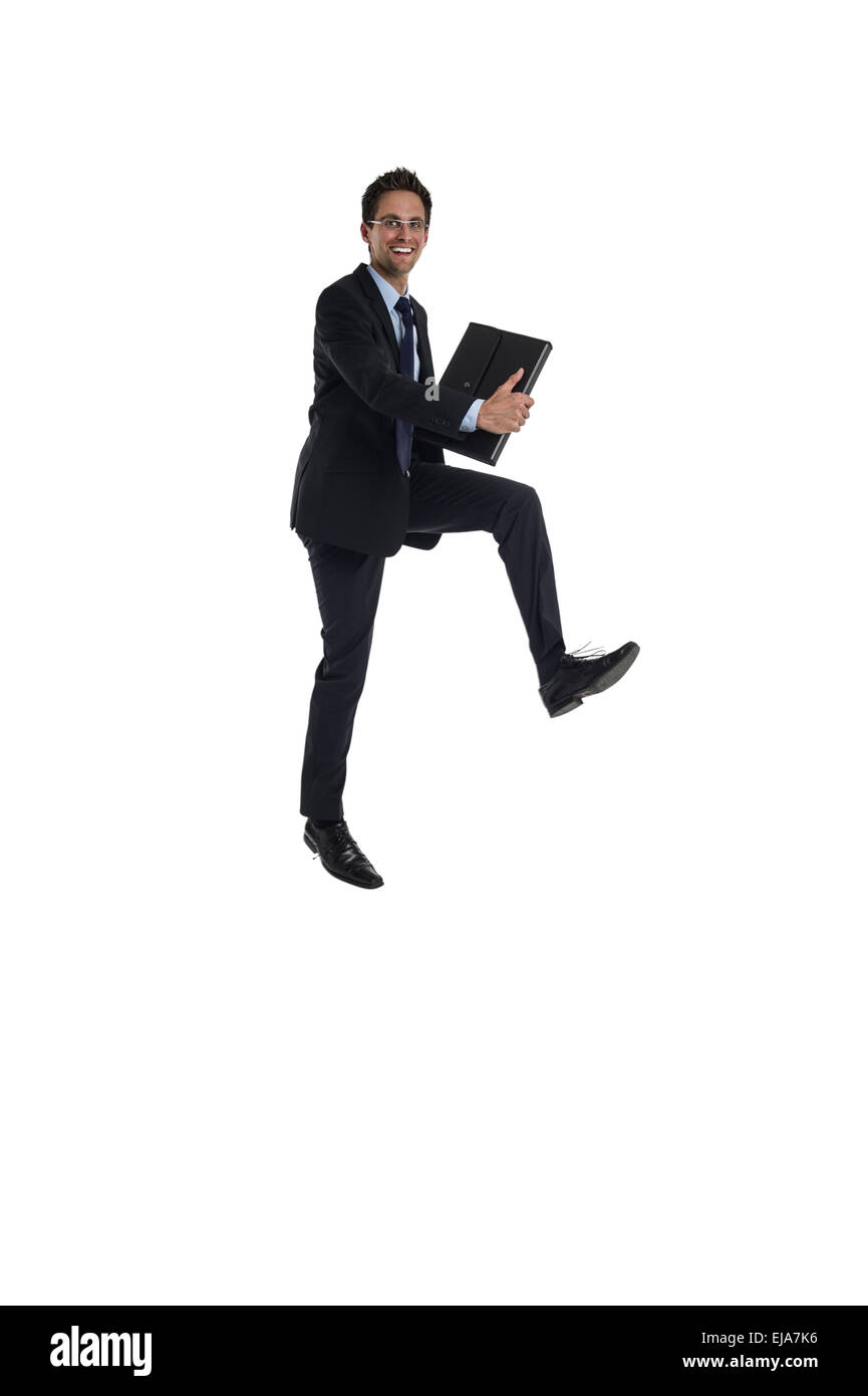 Jumping imprenditore con valigetta Foto Stock