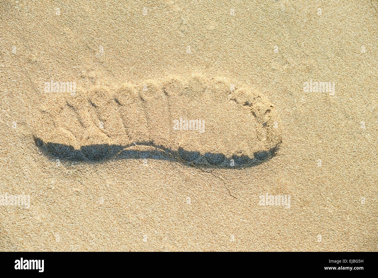 Impronta di scarpa nella sabbia Foto Stock