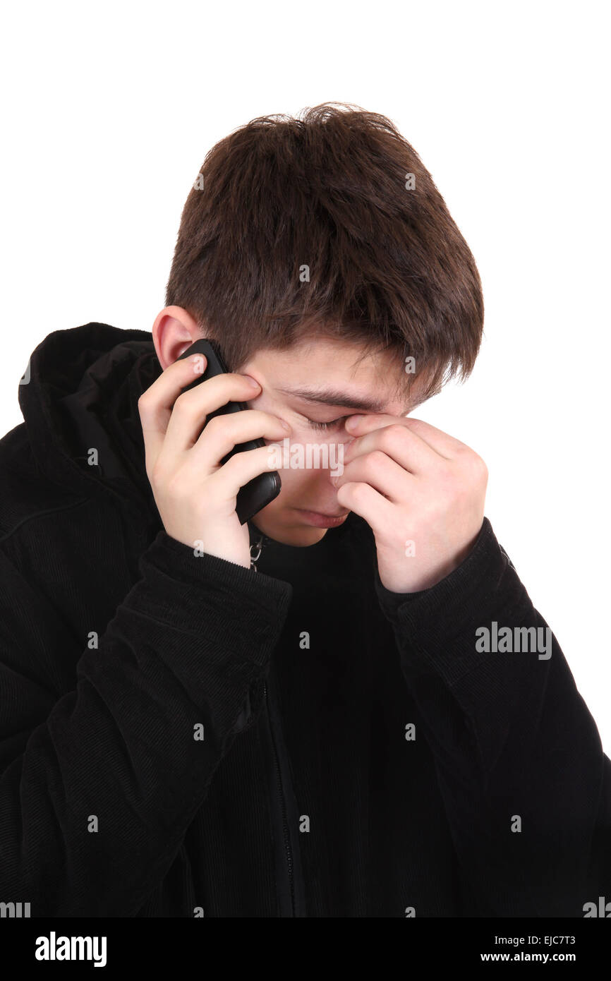 Triste adolescente con il cellulare Foto Stock