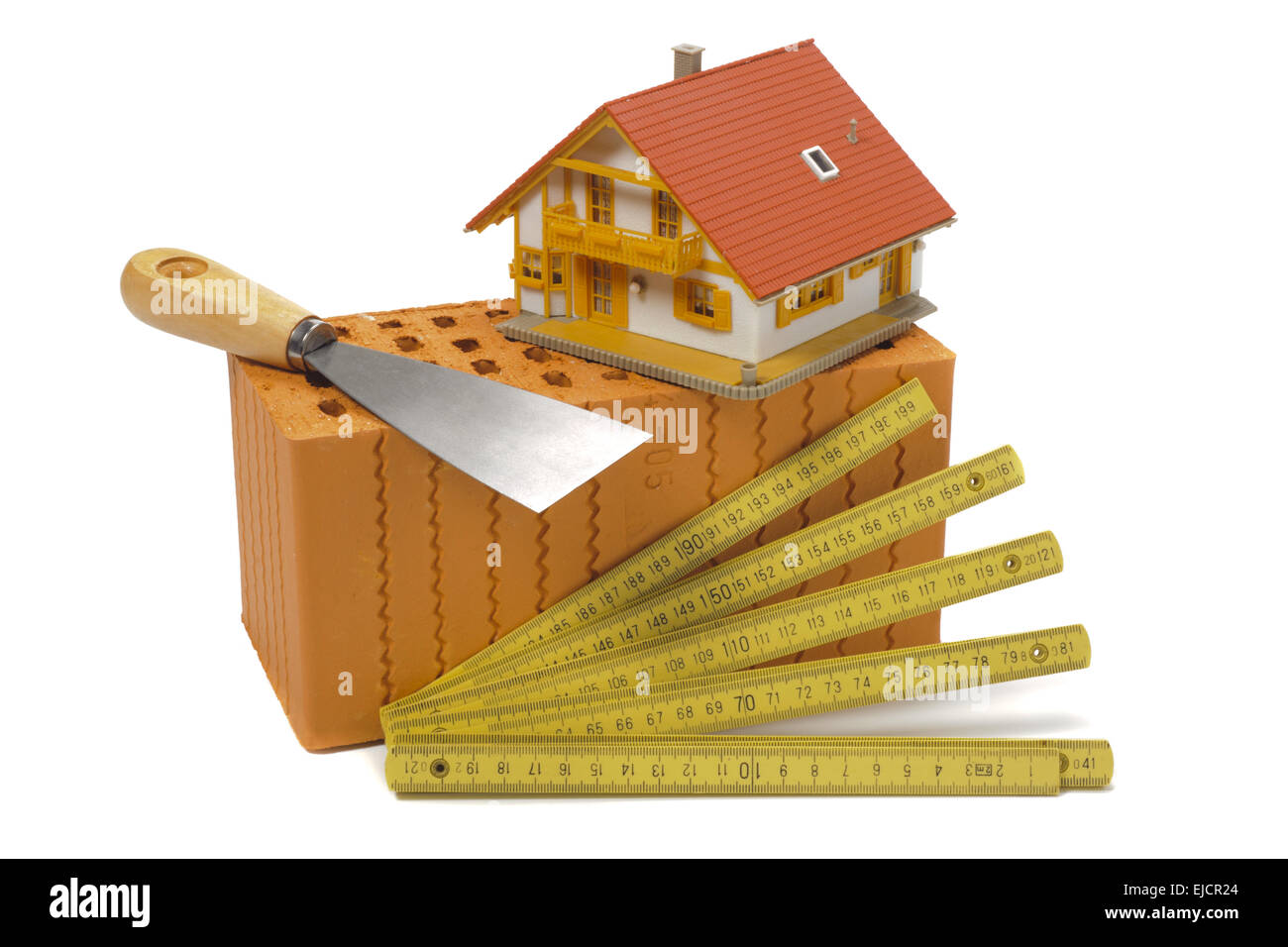 Modello di casa sul piano di costruzione con strumenti Foto Stock