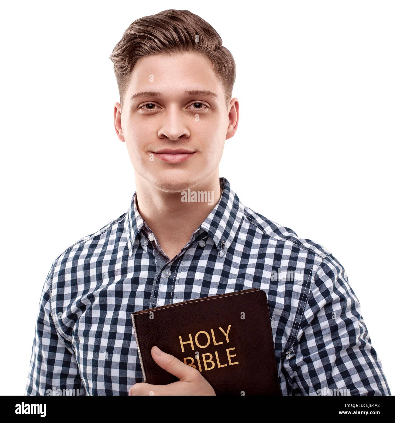 Bel giovane uomo felice tenendo una Bibbia Foto Stock