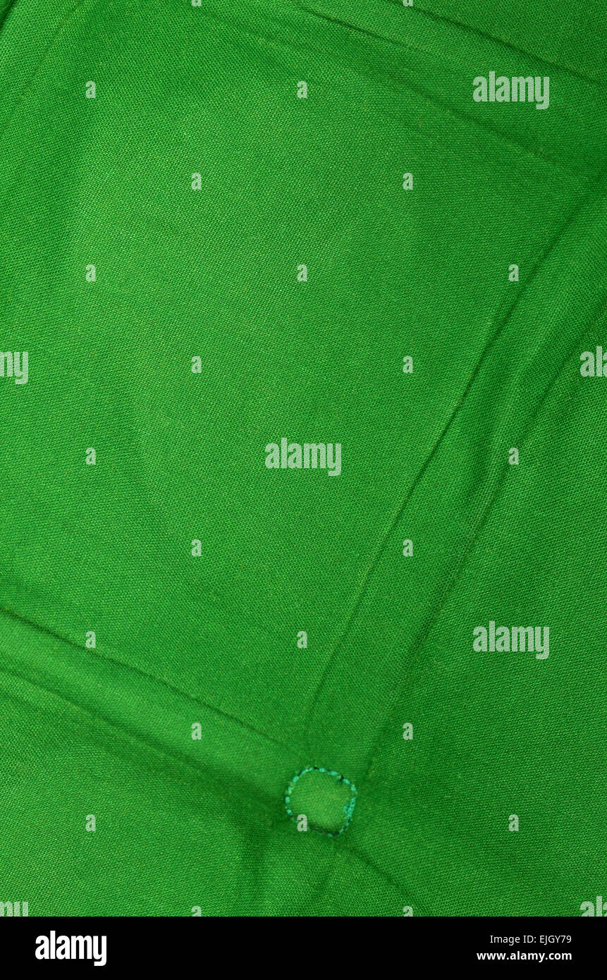 Chiudere fino a uno sfondo verde, tessile, dettaglio, full frame, verticale Foto Stock