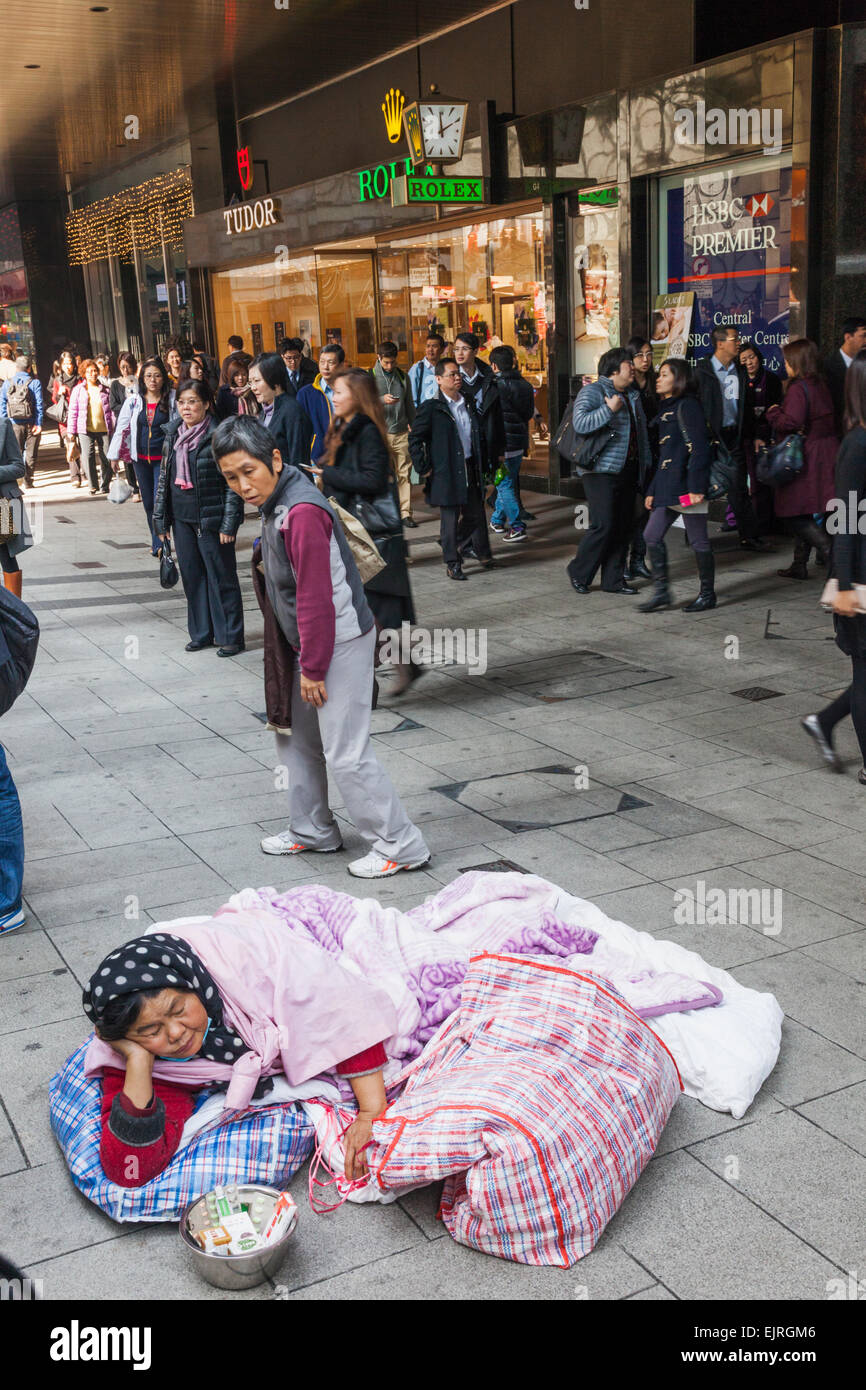 Cina, Hong Kong, centrale, donna senzatetto Foto Stock