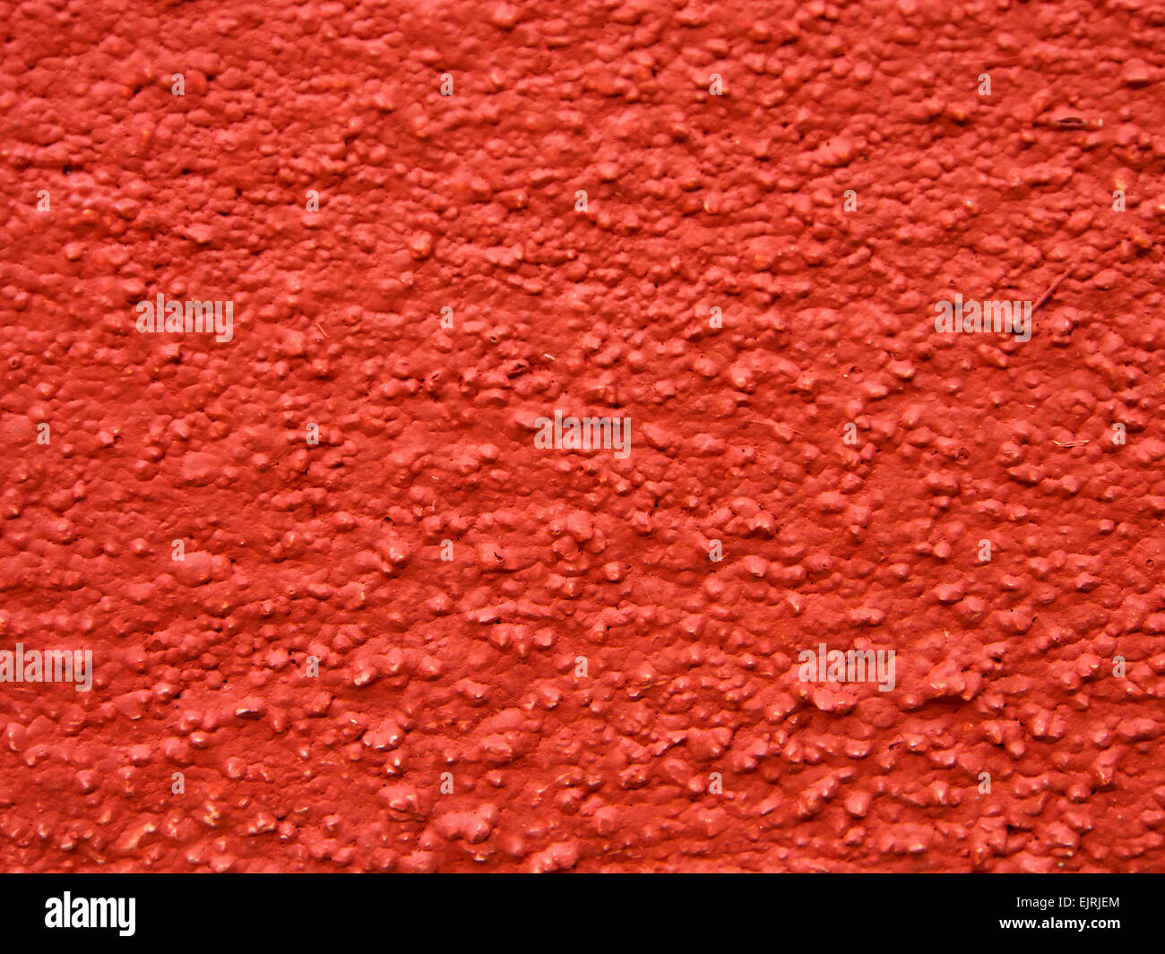 Texture della parete esterna verniciata con vernice marrone rossiccio. Foto Stock