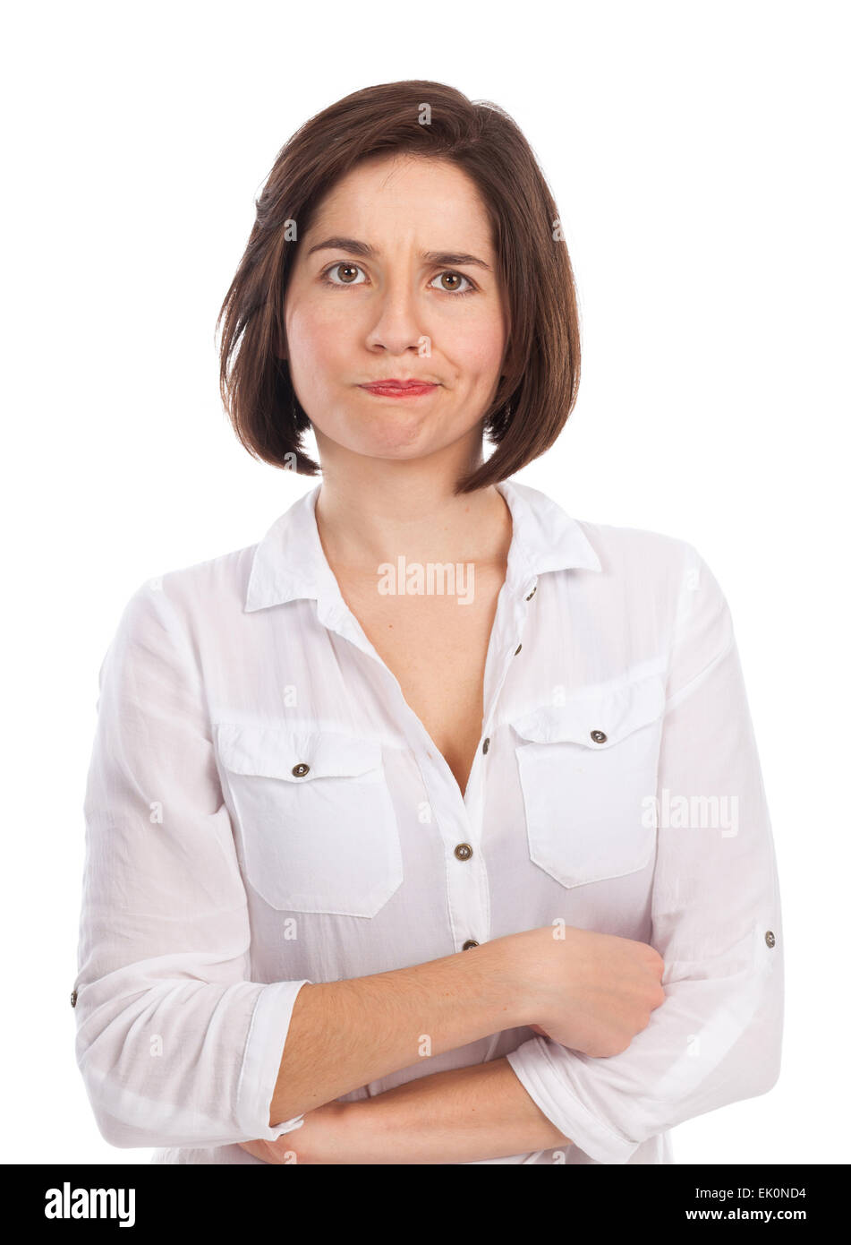 Ritratto di una giovane donna che guarda scontente, chiedendo, esitante, isolato su bianco Foto Stock