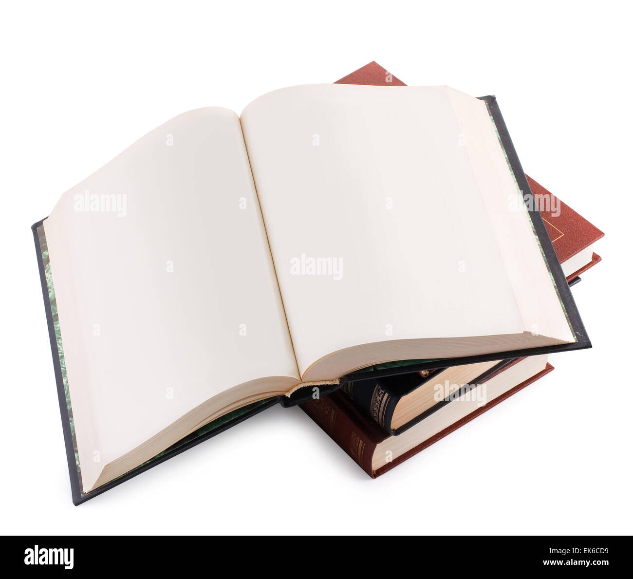 Libro aperto con le pagine bianche su una pila di libri Foto Stock