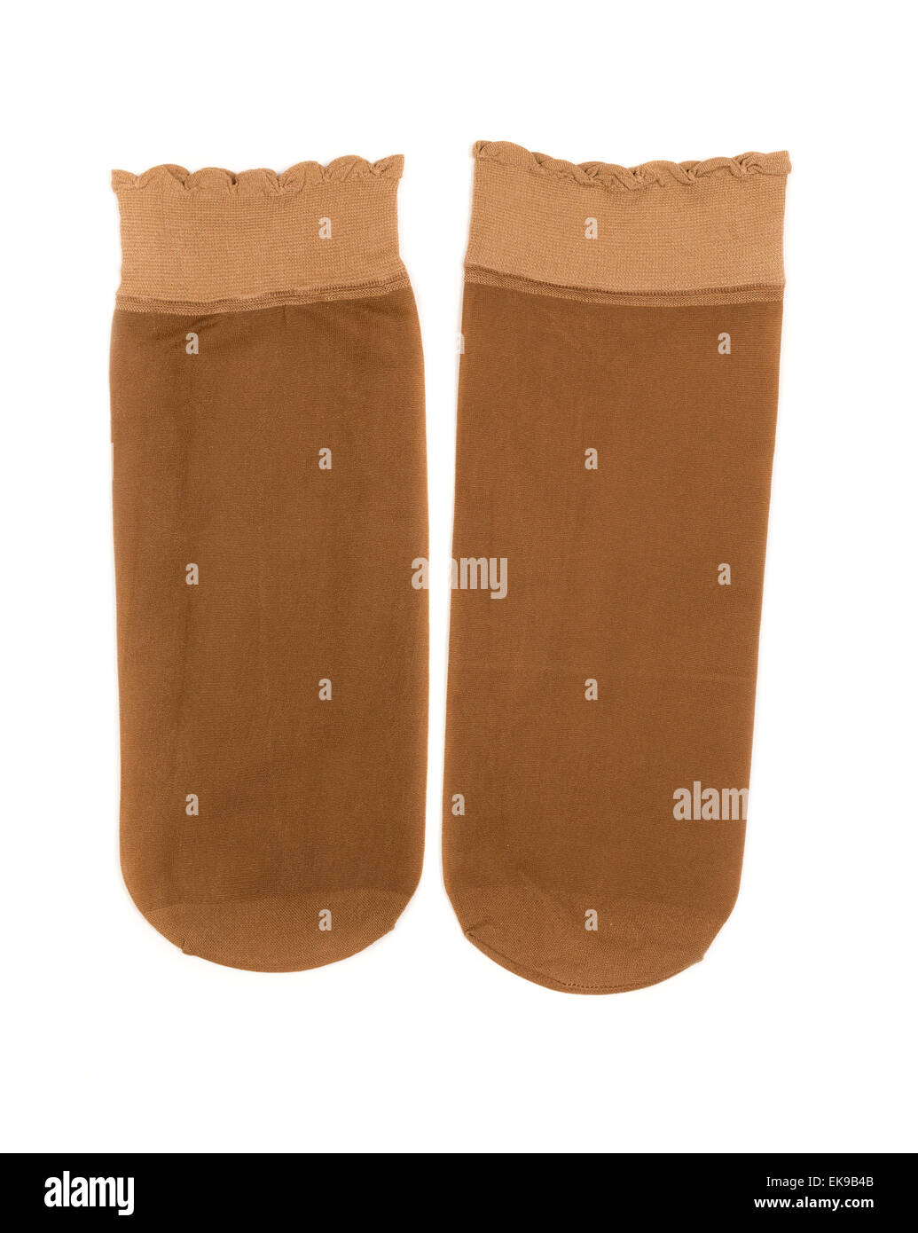 Coppia di beige donna calze di nylon. Isolare il bianco. Foto Stock