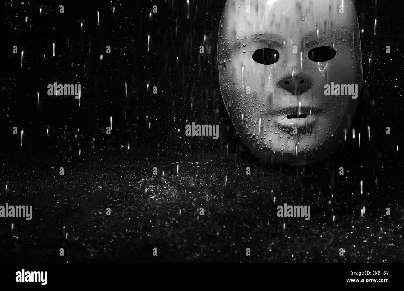 Maschera e pioggia Foto Stock