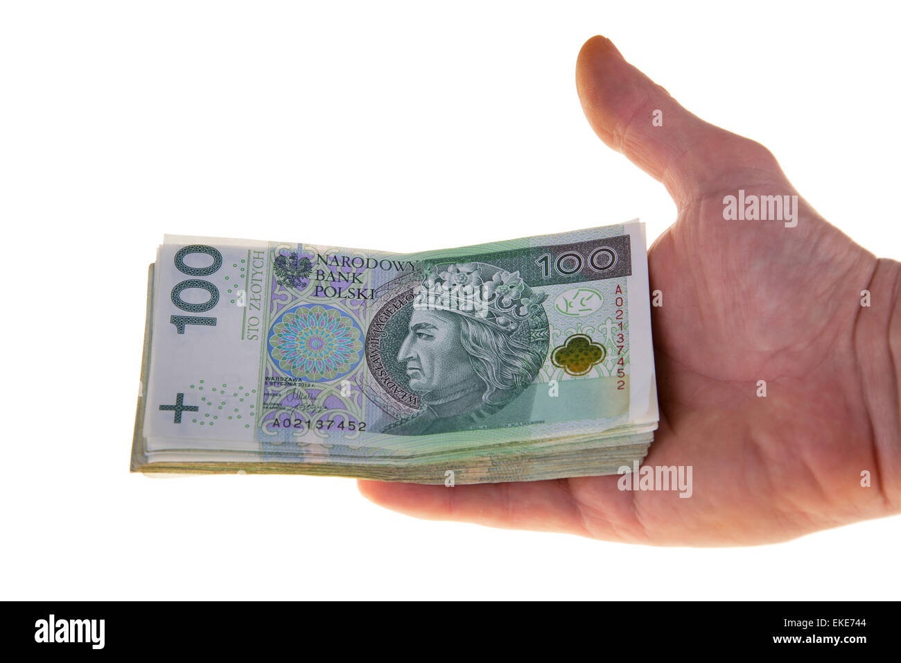 Valuta polacca banconote cento zloty, tenuto in mano, isolati su sfondo bianco, close-up Foto Stock