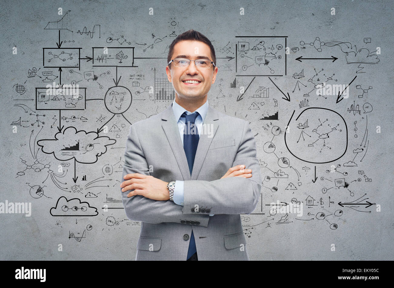 Sorridenti imprenditore in occhiali e tuta Foto Stock