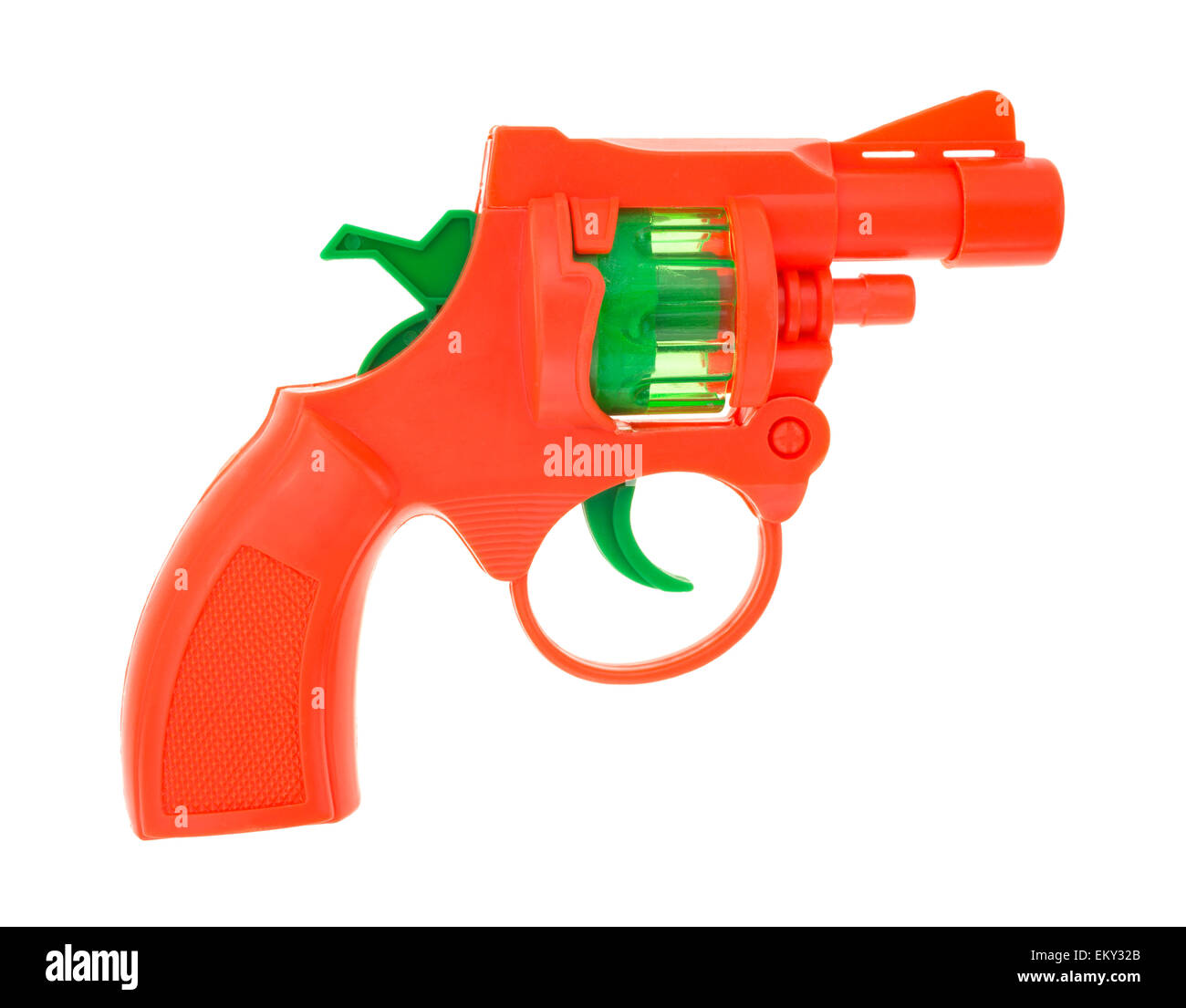 Una luce arancione brillante pistola giocattolo cap su uno sfondo bianco. Foto Stock
