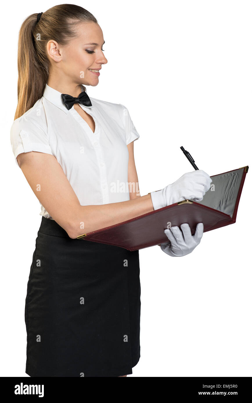 Cameriera di profilo permanente con denti sorriso Foto Stock