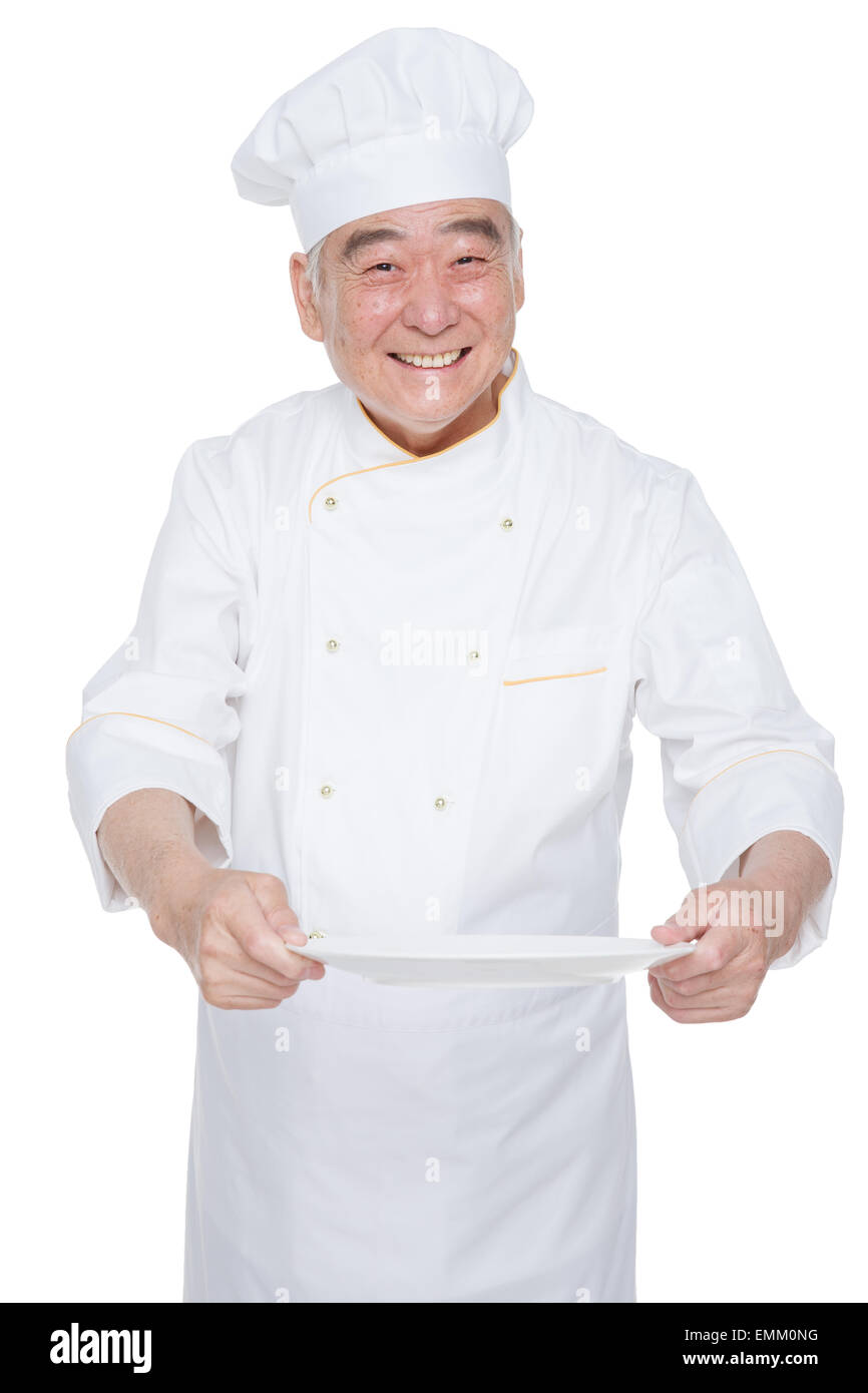 Un cuoco da indossare abbigliamento e uomo vecchio tenendo un vassoio Foto  stock - Alamy