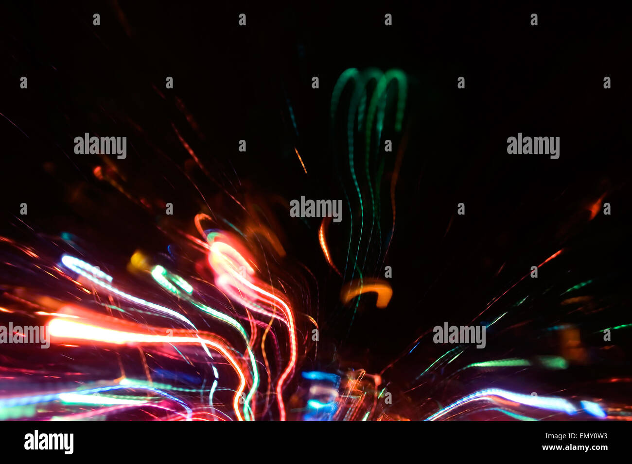 Abstract al neon multicolore scintille in movimento foto effetto di sfondo. Foto Stock