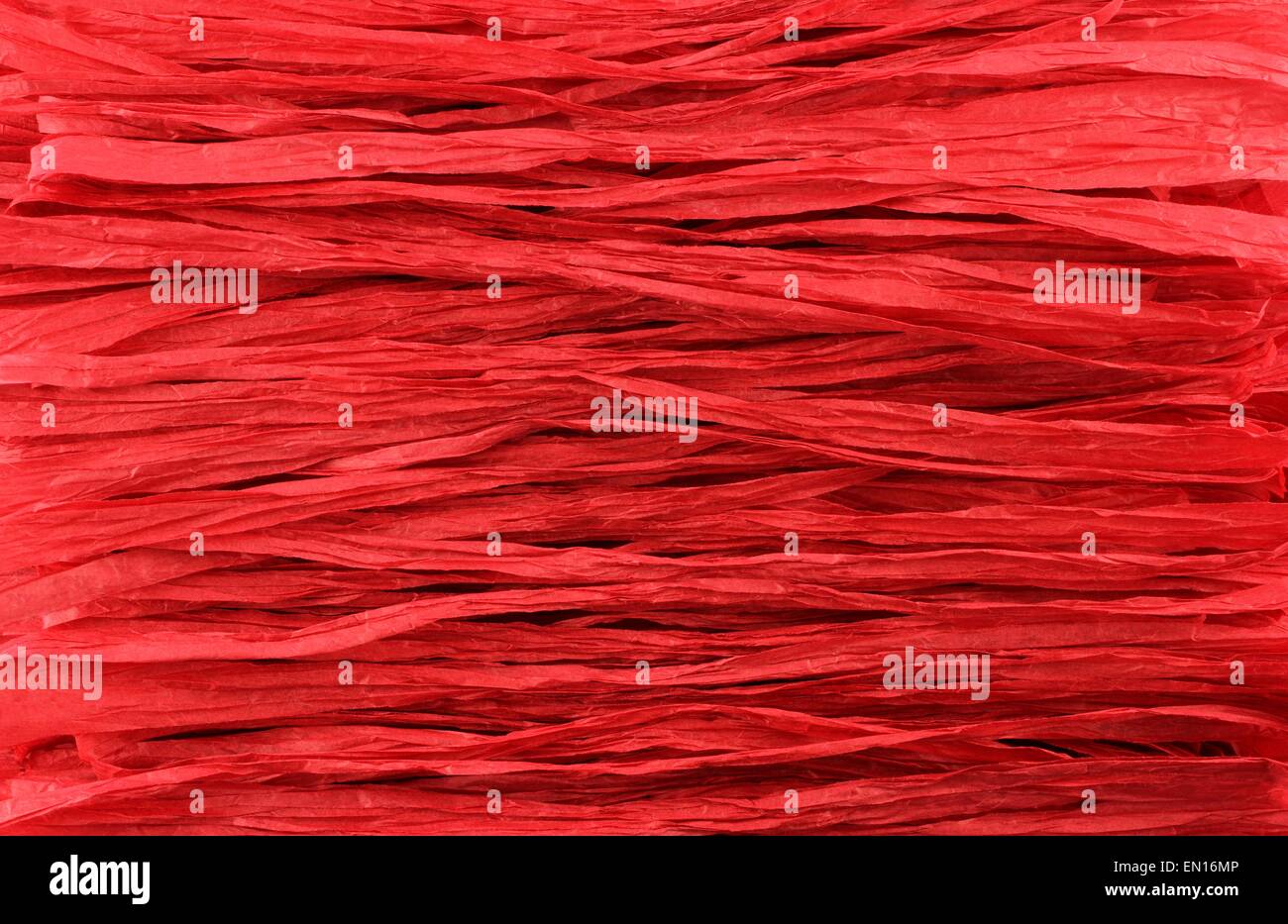Sfondo - carta rossa strisce di rafia situato in linee parallele Foto Stock