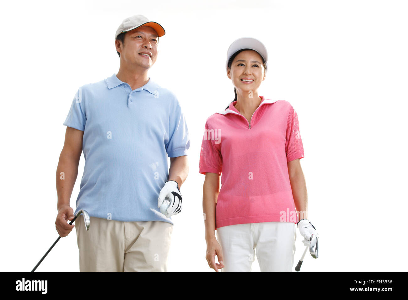 Una coppia di mezz'età giocando a golf Foto Stock