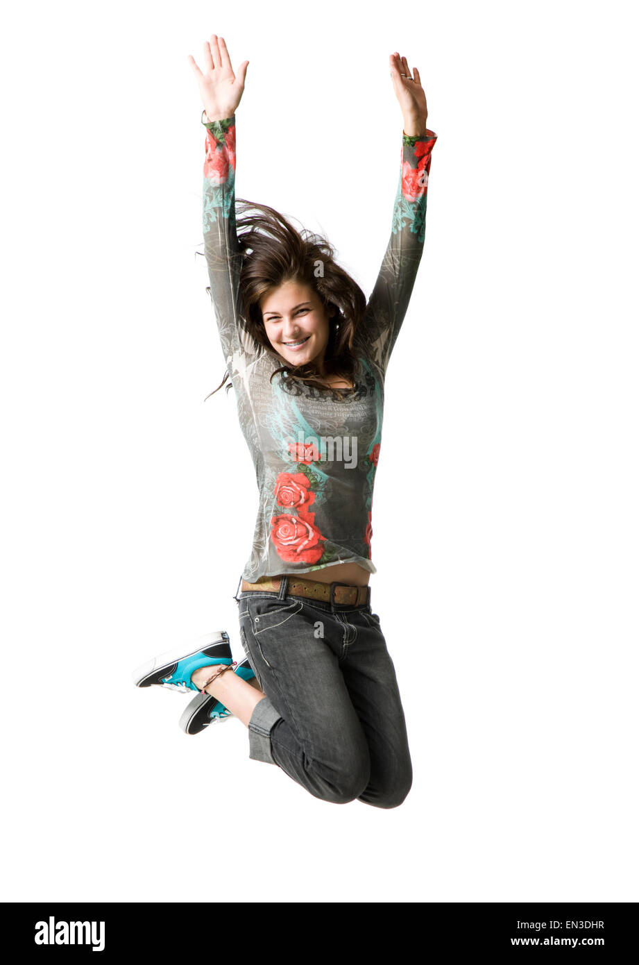 Ritratto in studio della ragazza adolescente (16-17) jumping, sorridente Foto Stock