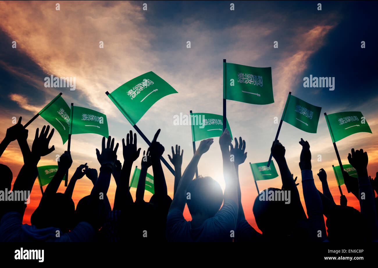 Sagome di Persone azienda Bandiera della Arabia Saudita Foto Stock