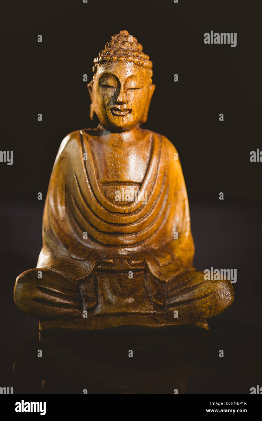 In legno statua del Buddha Foto Stock