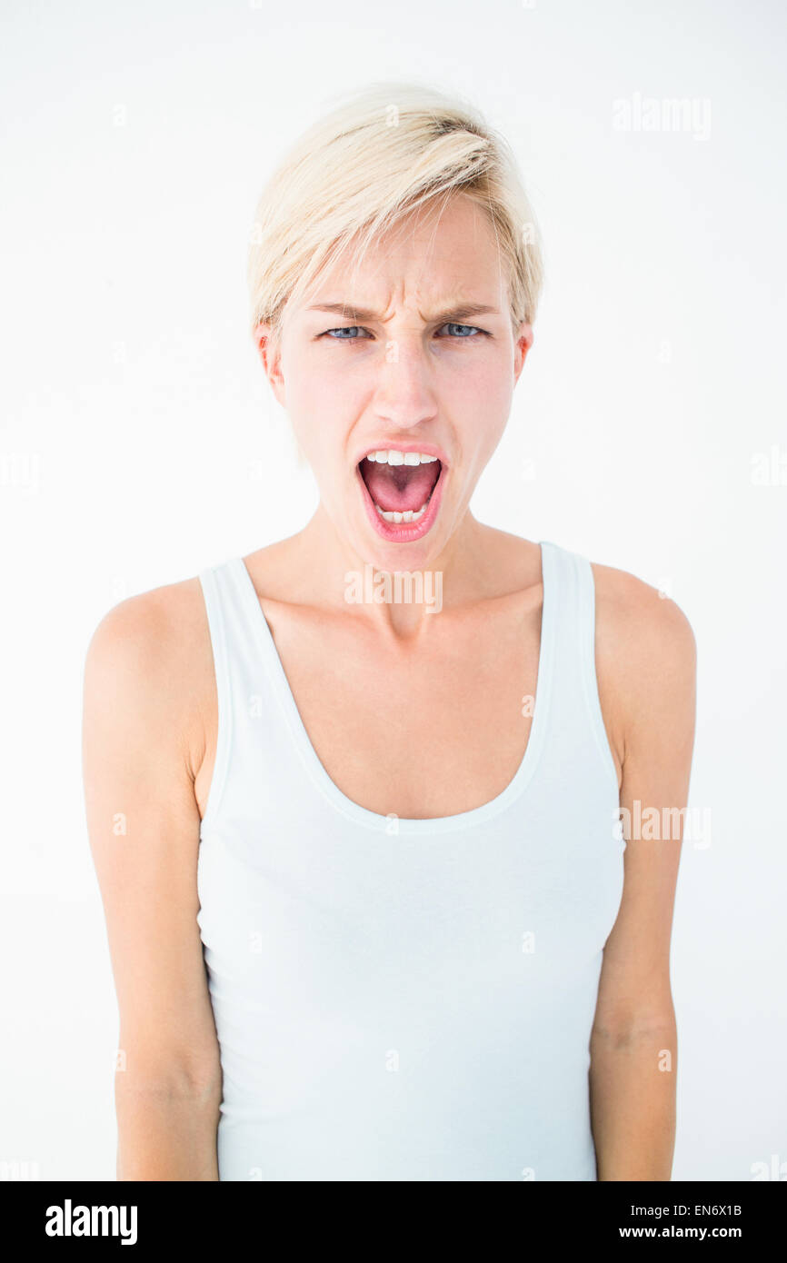 Arrabbiato donna bionda urlando Foto Stock