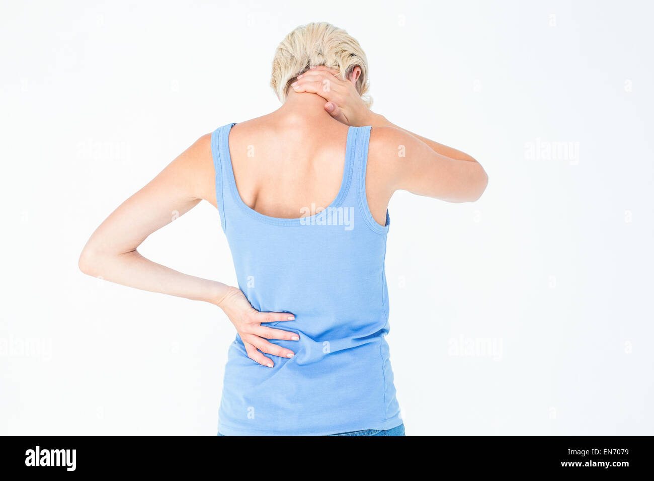 La donna che soffre di dolori al collo Foto Stock
