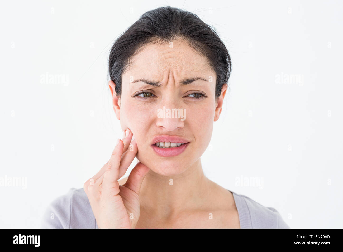 La donna che soffre di dolore di denti Foto Stock
