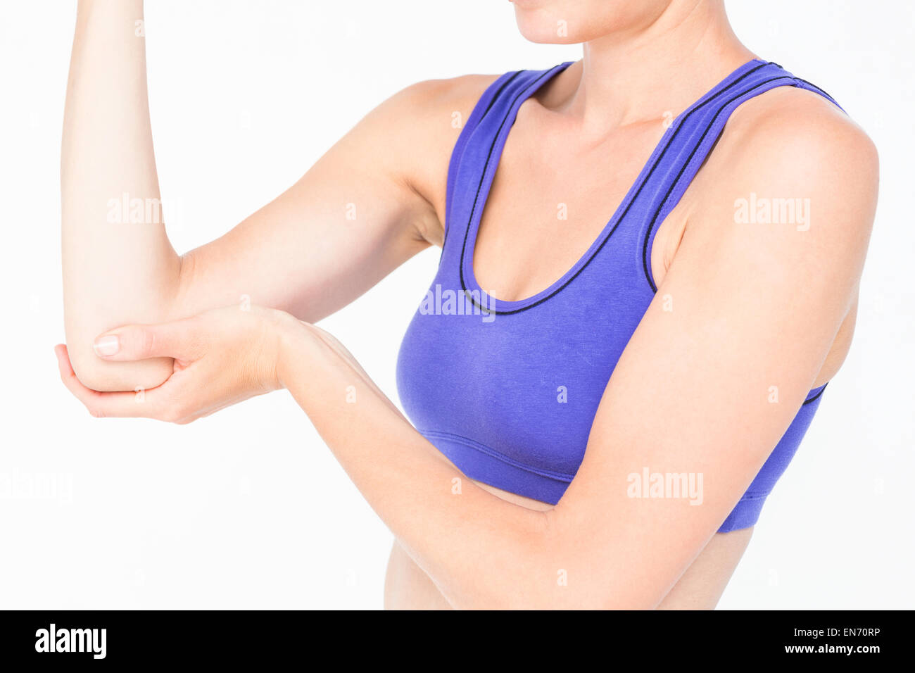 Sportivo da donna di toccare il suo gomito Foto Stock