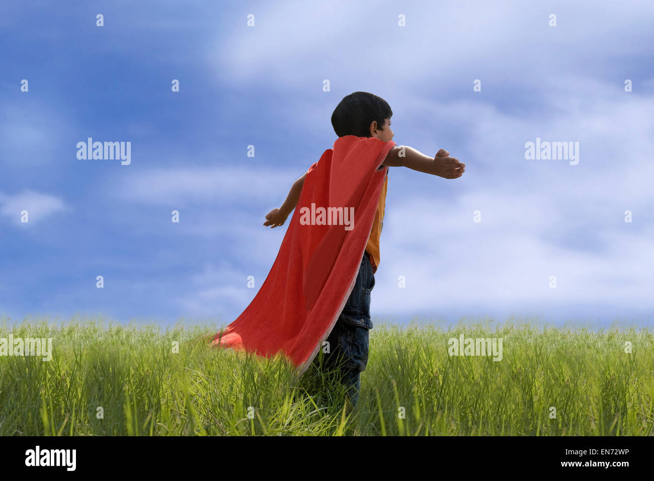 Bambino in posa come Superman Foto Stock