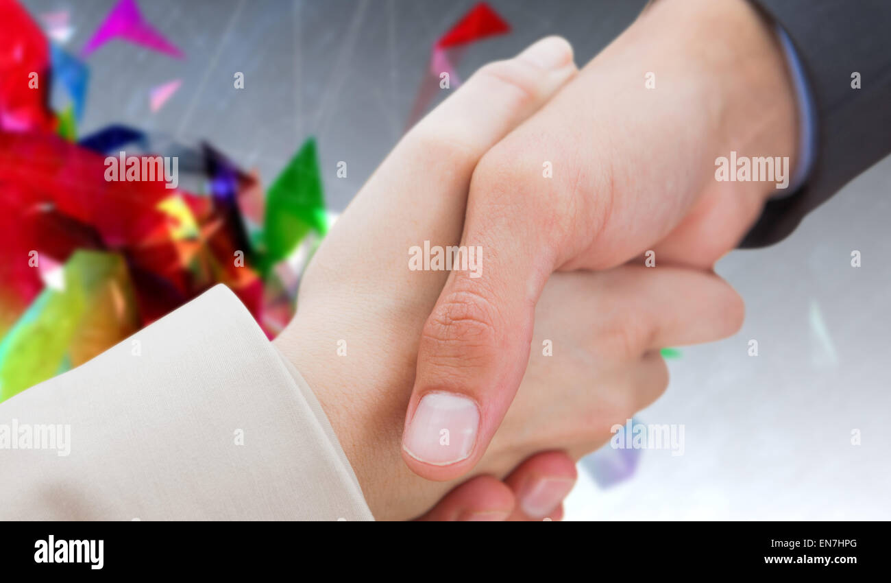 Immagine composita di chiudere fino a nuovi partner stringono le mani Foto Stock