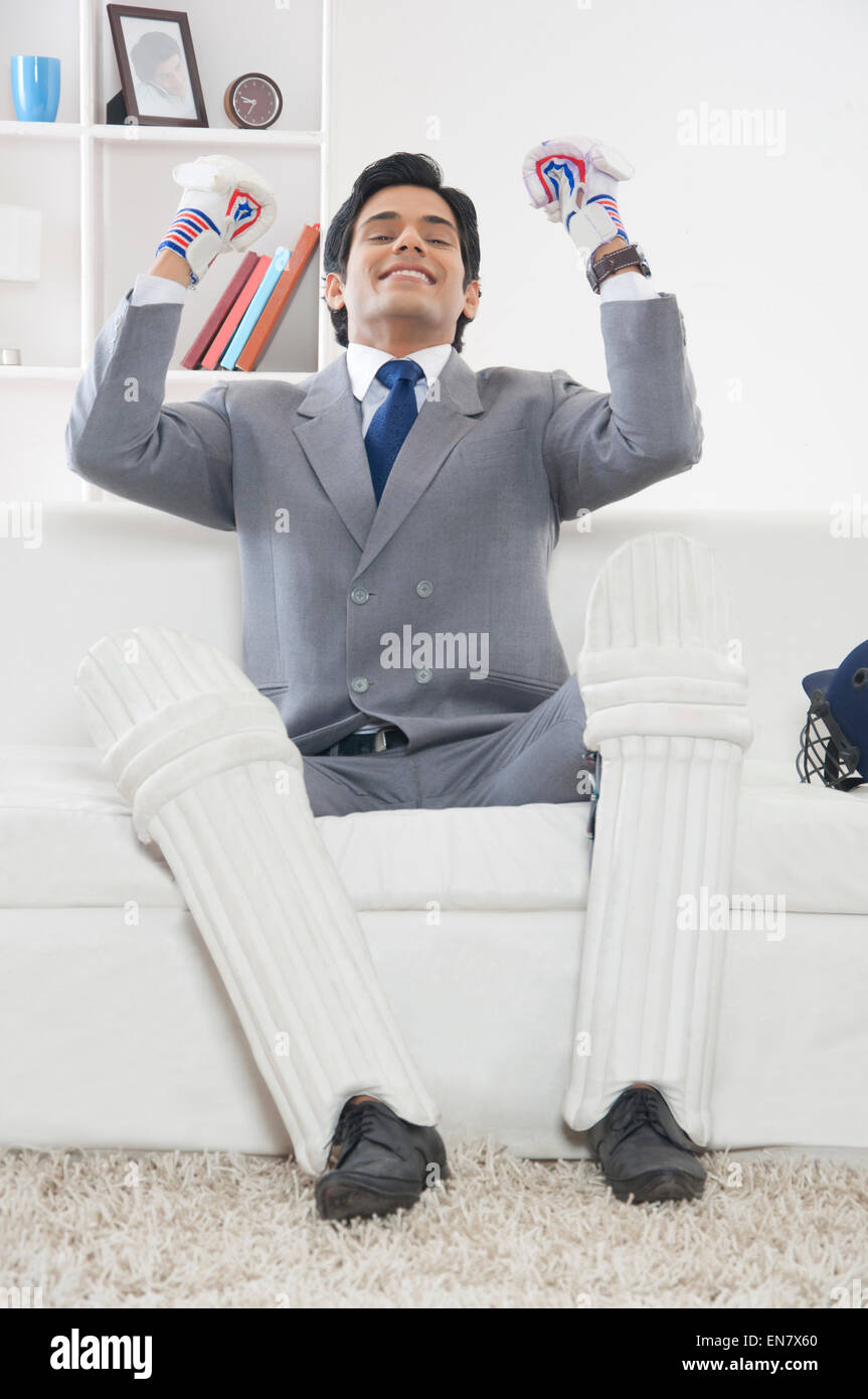 Executive con ingranaggio di cricket gioia Foto Stock