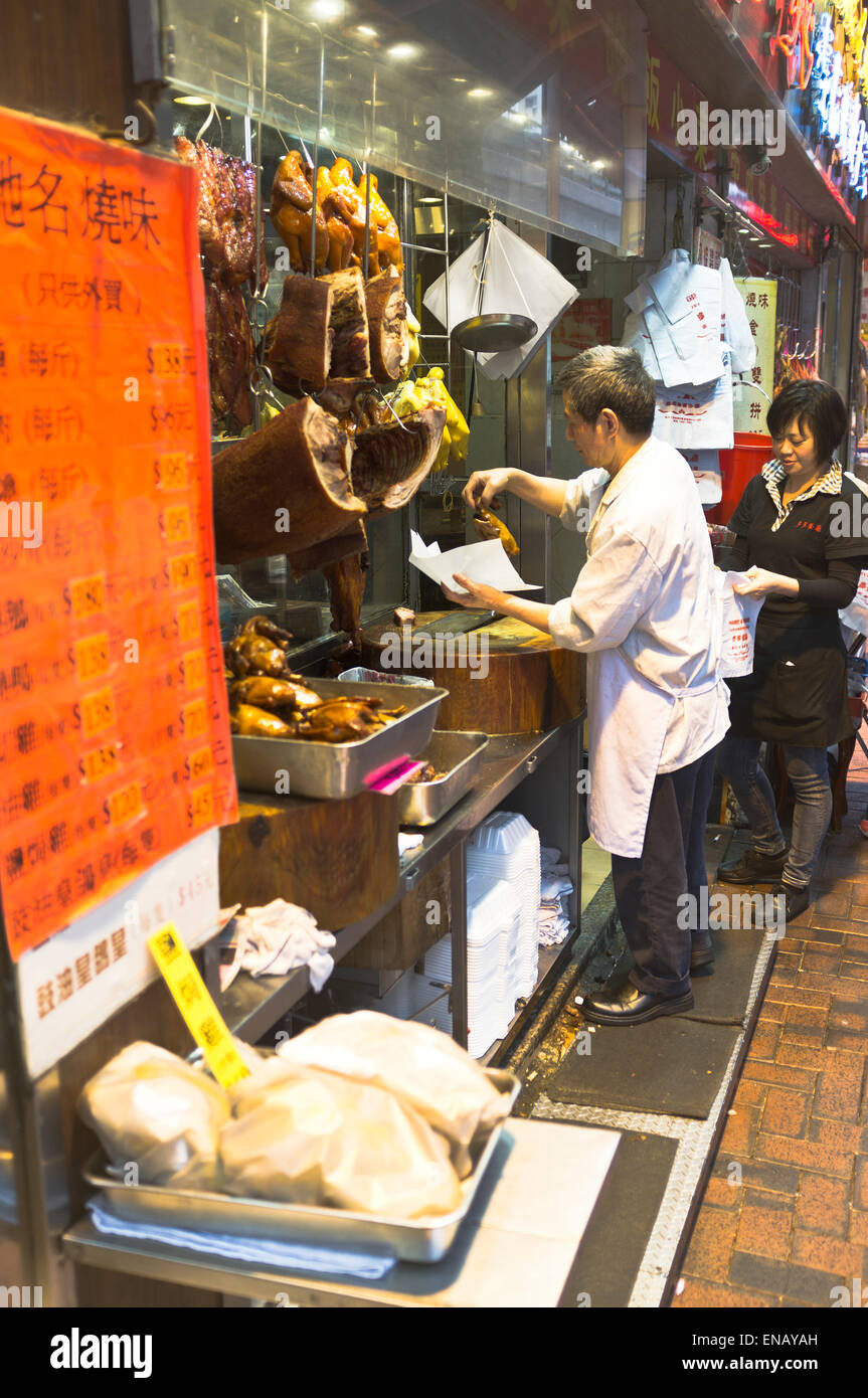 dh Market Shop CAUSEWAY BAY HONG KONG Chinese Stall proprietario che vende carne cotta pavimentazione negozio alimentare asian Street cina Foto Stock