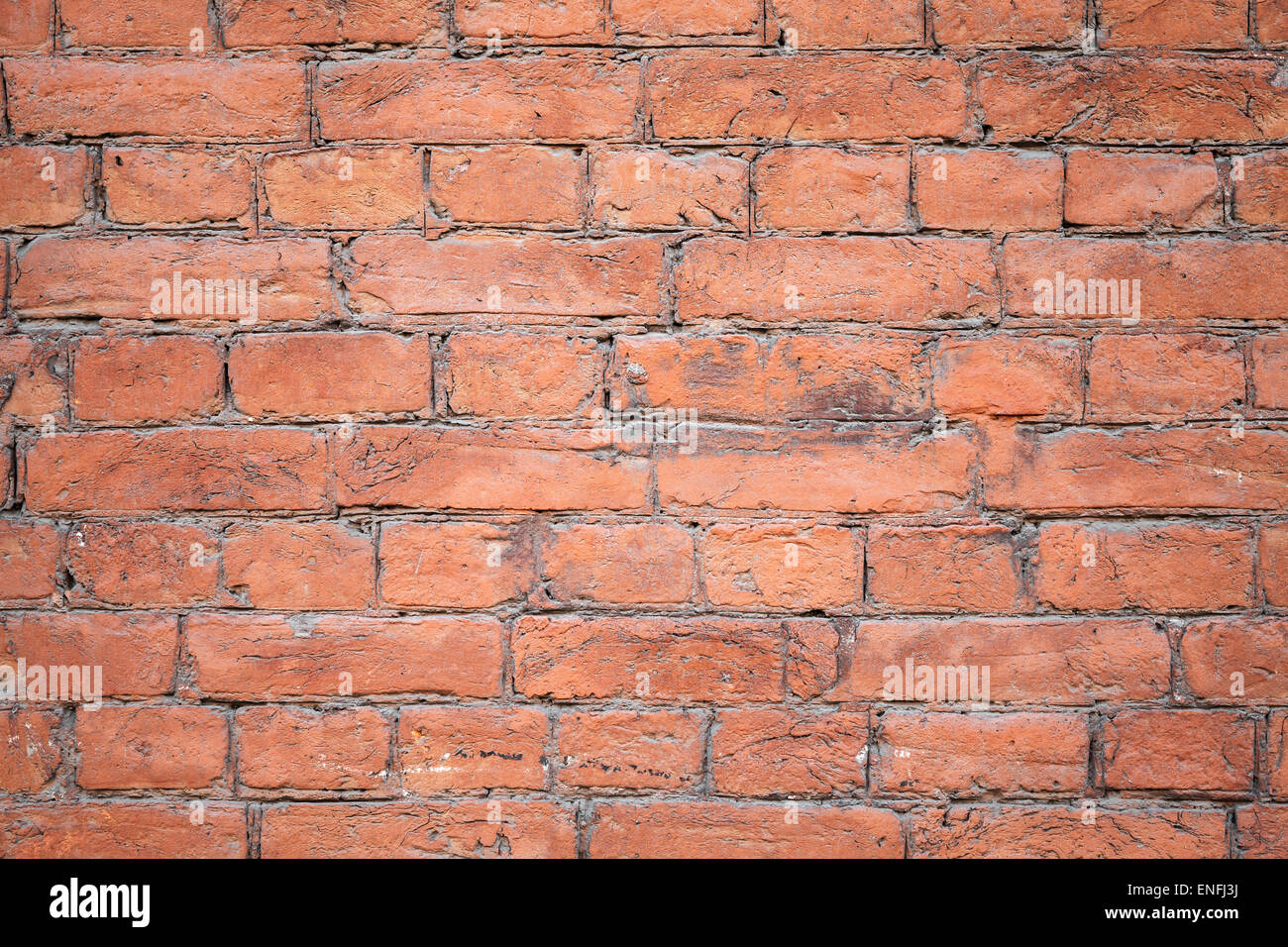 Texture di sfondo di un vecchio dipinto di rosso la parete in mattoni Foto Stock
