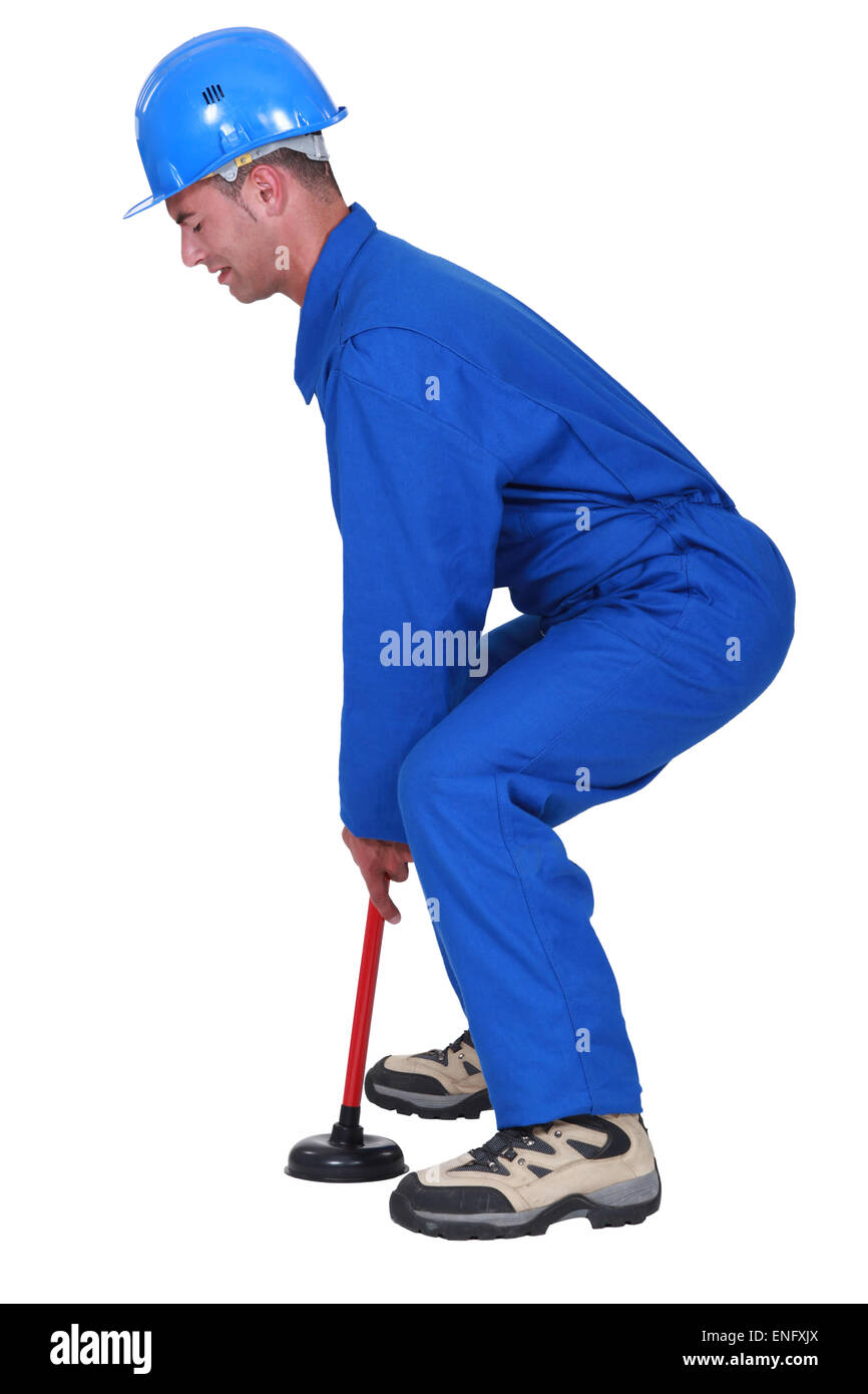 Plumber manipolazione stantuffo nel profilo Foto Stock