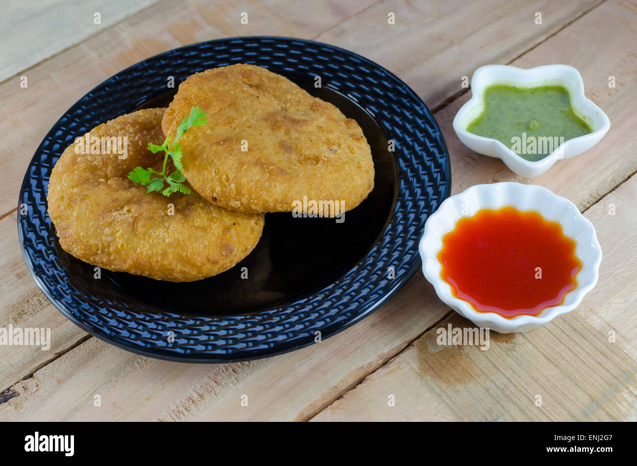 Kachori è un popolare fritti snack indiano. Foto Stock